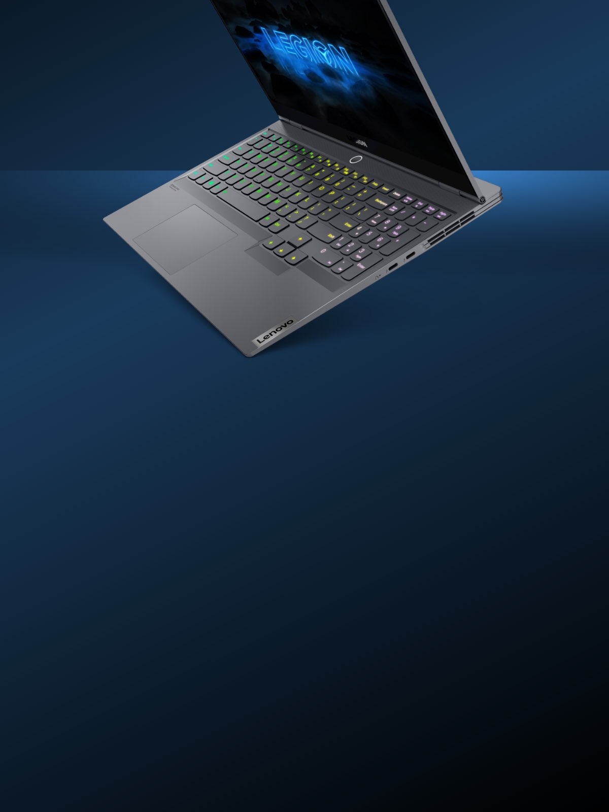 Lenovo Legion Slim 7i laptop front-right view with backlit keyboard floating against dark blue background