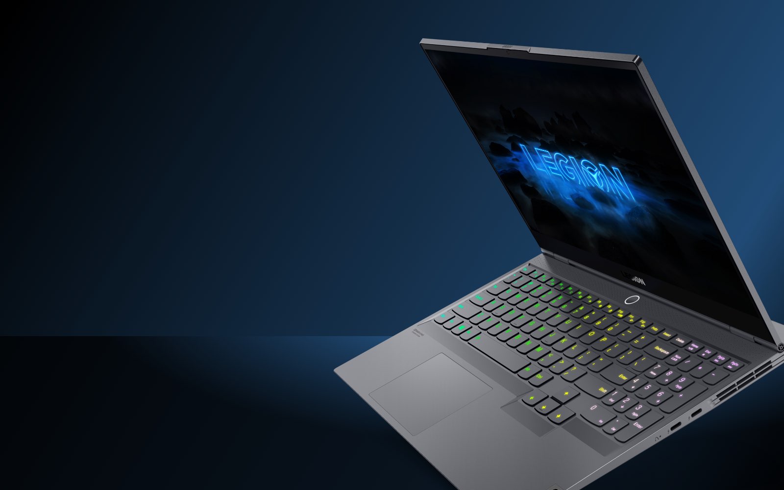 Lenovo Legion Slim 7i laptop front-right view with backlit keyboard floating against dark blue background