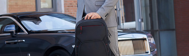 Person on the street carrying Lenovo backpack