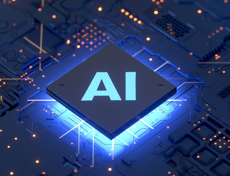Primo piano di componenti tecnologici illuminati con punto focale su scritta AI. 
