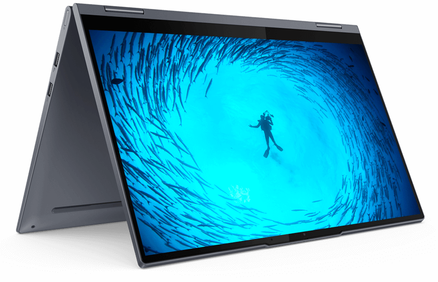 Lenovo 2-in-1 in tent mode, with display showing an image of a SCUBA diver in a clear spot surrounded by large fish swimming in a circle around the diver 