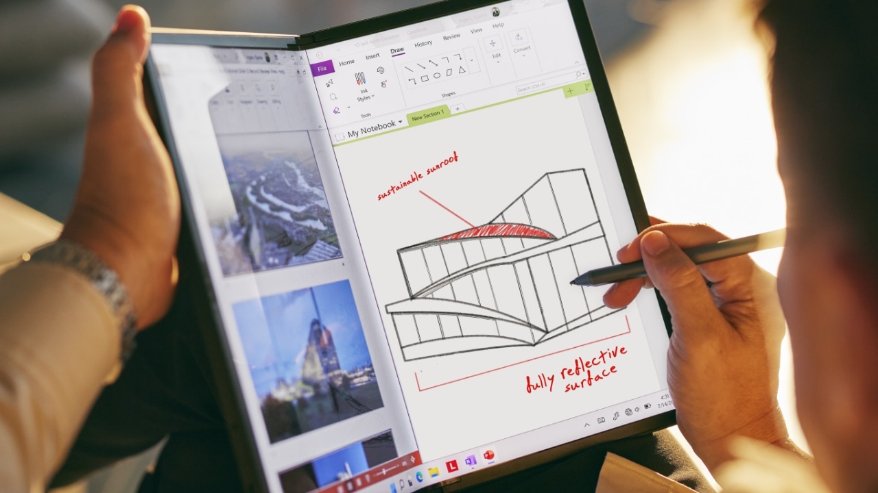 Lenovo ThinkPad X1 Fold showcasing the optional pen in use in book mode.