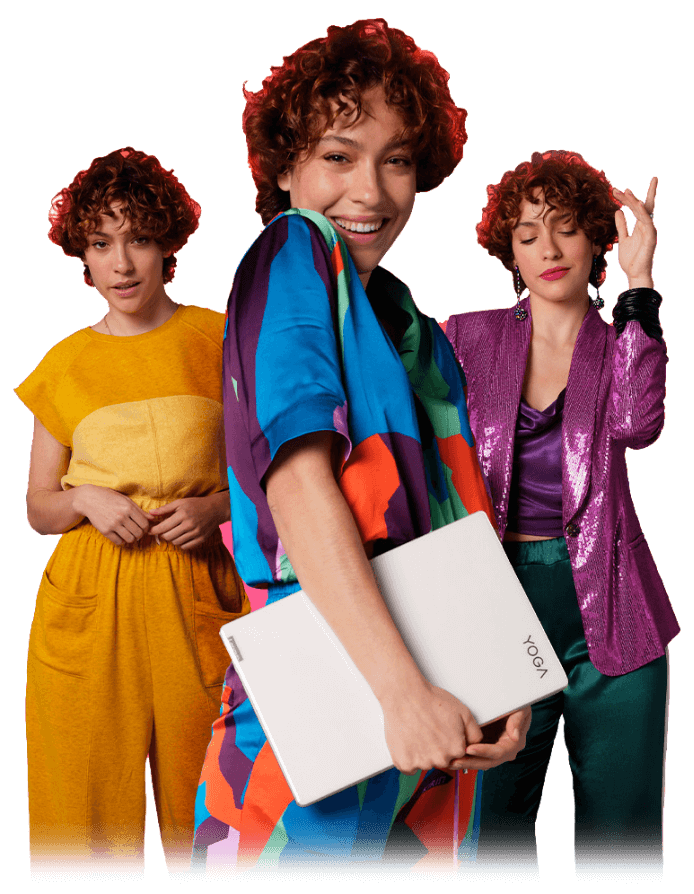 Three women standing next to each other with the first two women standing side-by-side and one standing slightly in front of them holding a Yoga laptop