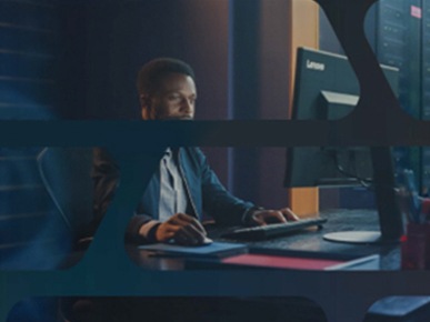 Man sitting at a desk in a data center