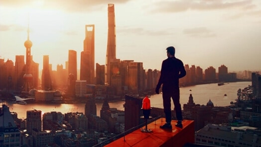 Man overlooking Cityscape with river