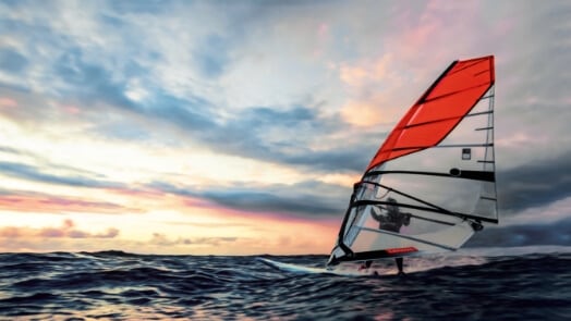 Person on a sailboard, with a Lenovo branded sail